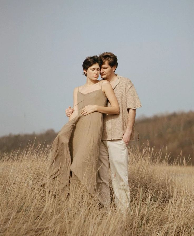 Ivory midi dress with knit polo and stone trousers