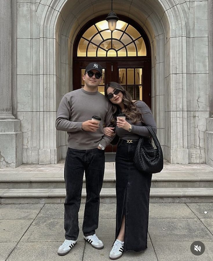 Grey knit and black denim maxi skirt outside an arched stone building